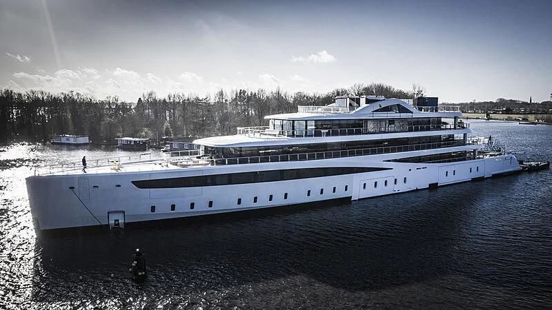 a large ship in the water aboard DEFY Yacht for Sale