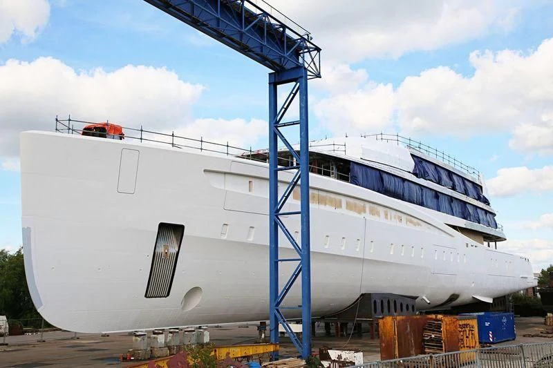 a large white ship aboard DEFY Yacht for Sale