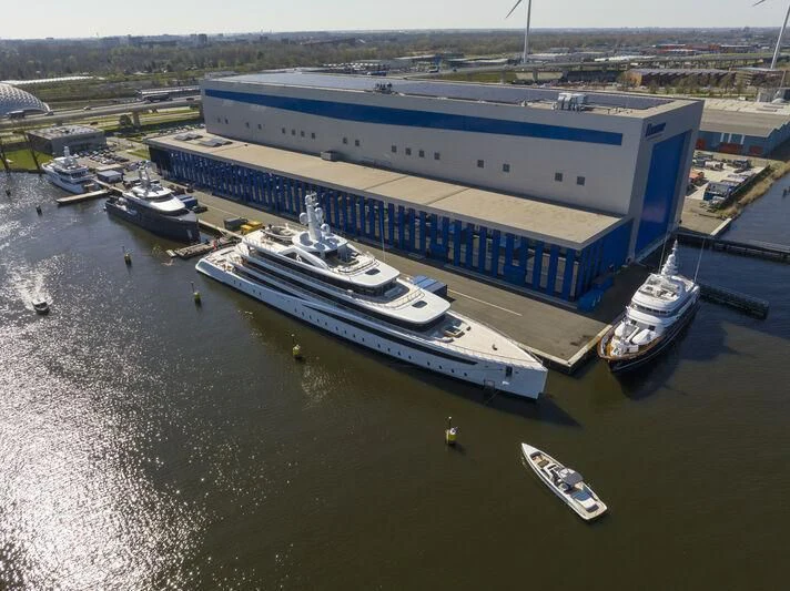 a large ship docked aboard DEFY Yacht for Sale