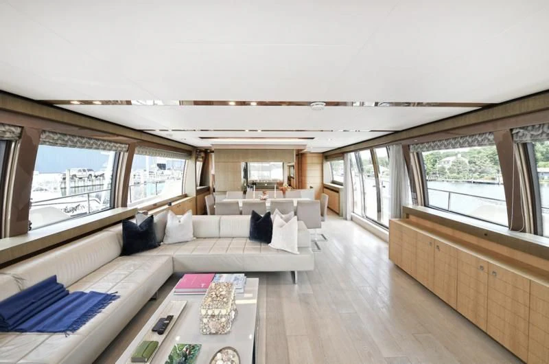 a living room with a large window aboard IN TOO DEEP Yacht for Sale