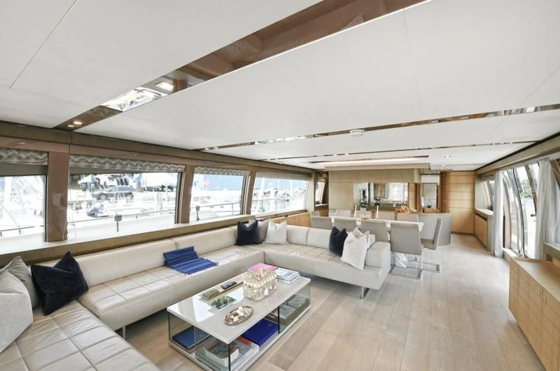 a large living room with a large open window aboard IN TOO DEEP Yacht for Sale