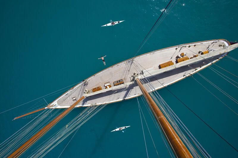 a large ship with a plane flying over it aboard ELENA OF LONDON Yacht for Sale