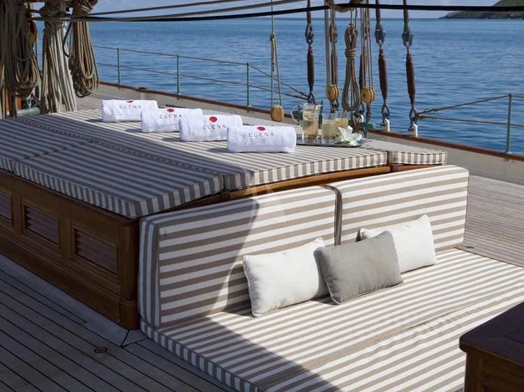 a deck with a bed and pillows aboard ELENA OF LONDON Yacht for Sale