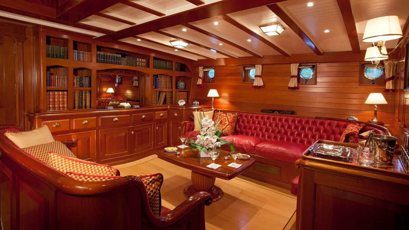 a living room with a couch and a coffee table aboard ELENA OF LONDON Yacht for Sale