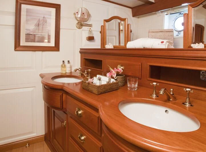 a bathroom with a sink and a mirror aboard ELENA OF LONDON Yacht for Sale