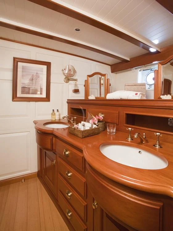 a bathroom with a sink and a mirror aboard ELENA OF LONDON Yacht for Sale