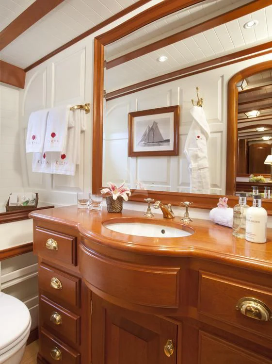 a bathroom with a large mirror aboard ELENA OF LONDON Yacht for Sale