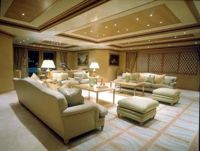a living room with a large couch aboard CONSTELLATION Yacht for Sale
