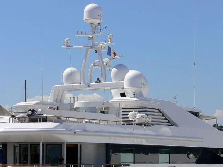 a large white ship with a satellite on top aboard CONSTELLATION Yacht for Sale