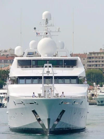a large white boat with a group of people on it aboard CONSTELLATION Yacht for Sale