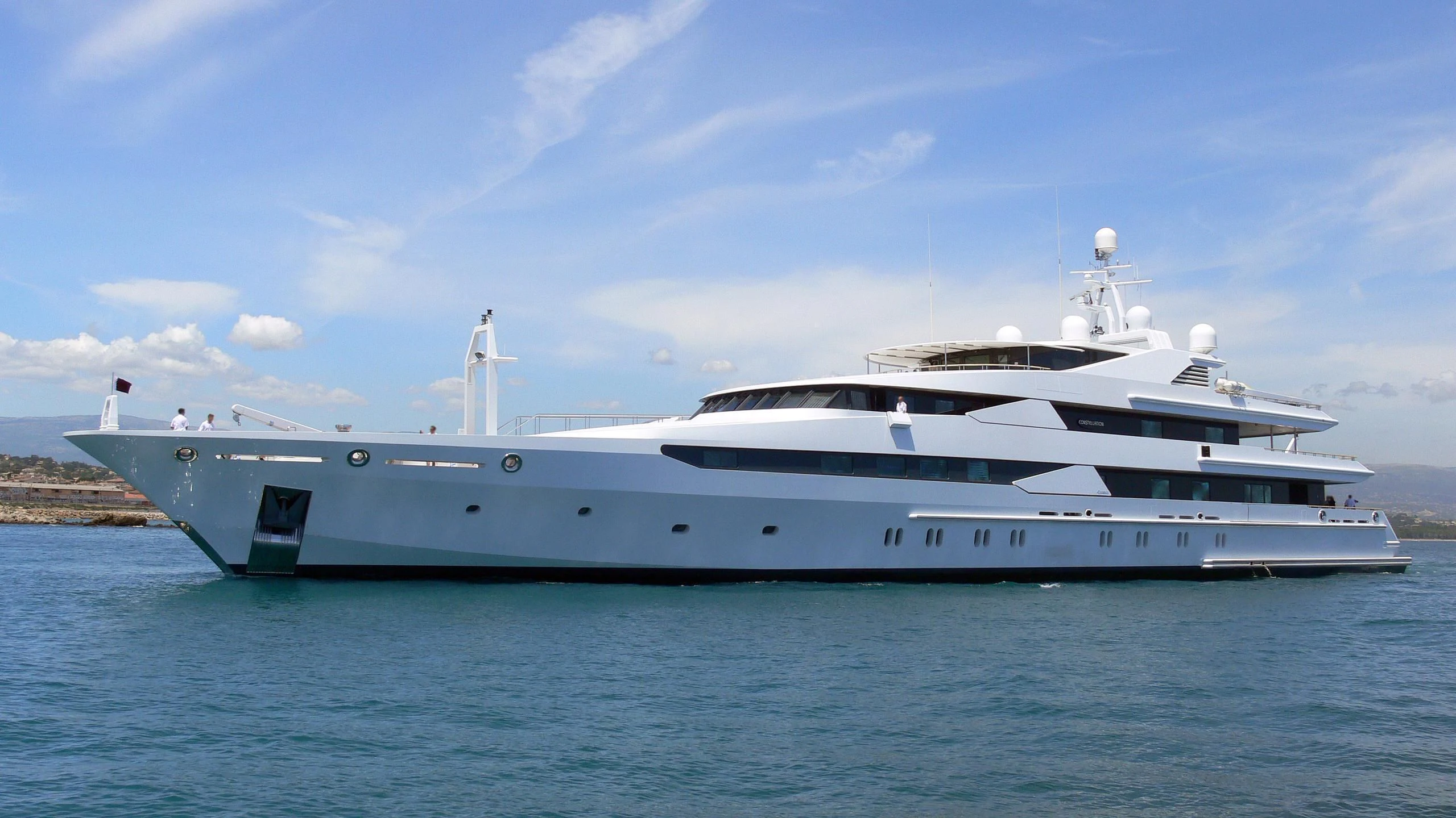 a white yacht on the water aboard CONSTELLATION Yacht for Sale