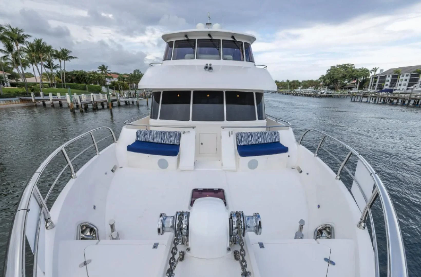 a white boat in a harbor aboard WRITE SOON Yacht for Sale