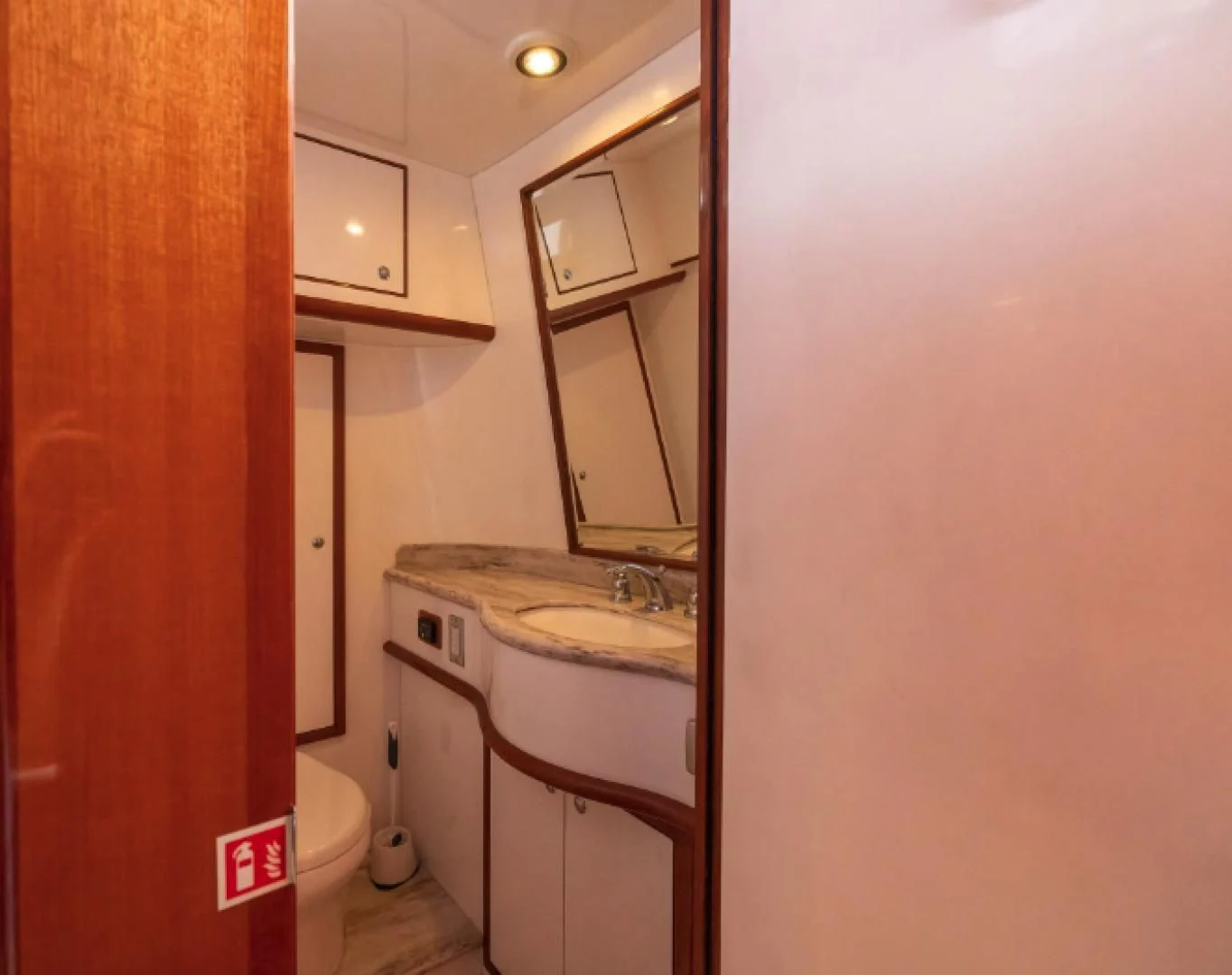a bathroom with a sink and a toilet aboard WRITE SOON Yacht for Sale