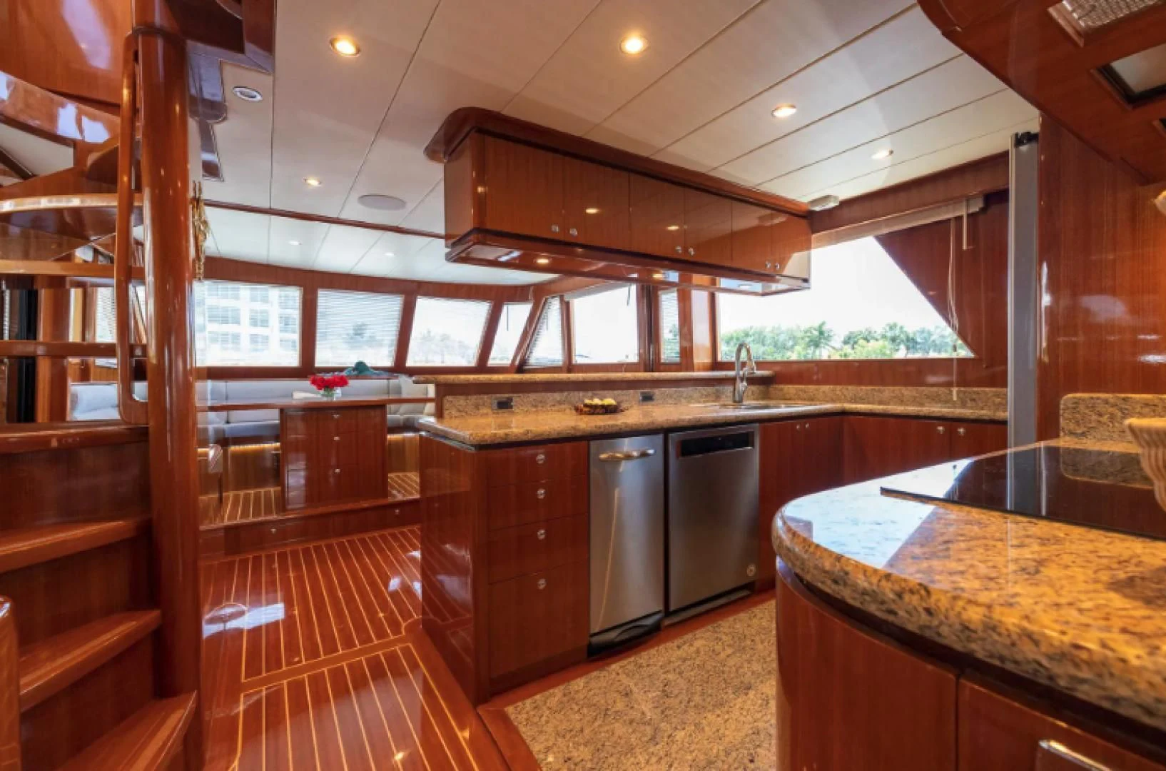 a kitchen with wooden cabinets aboard WRITE SOON Yacht for Sale