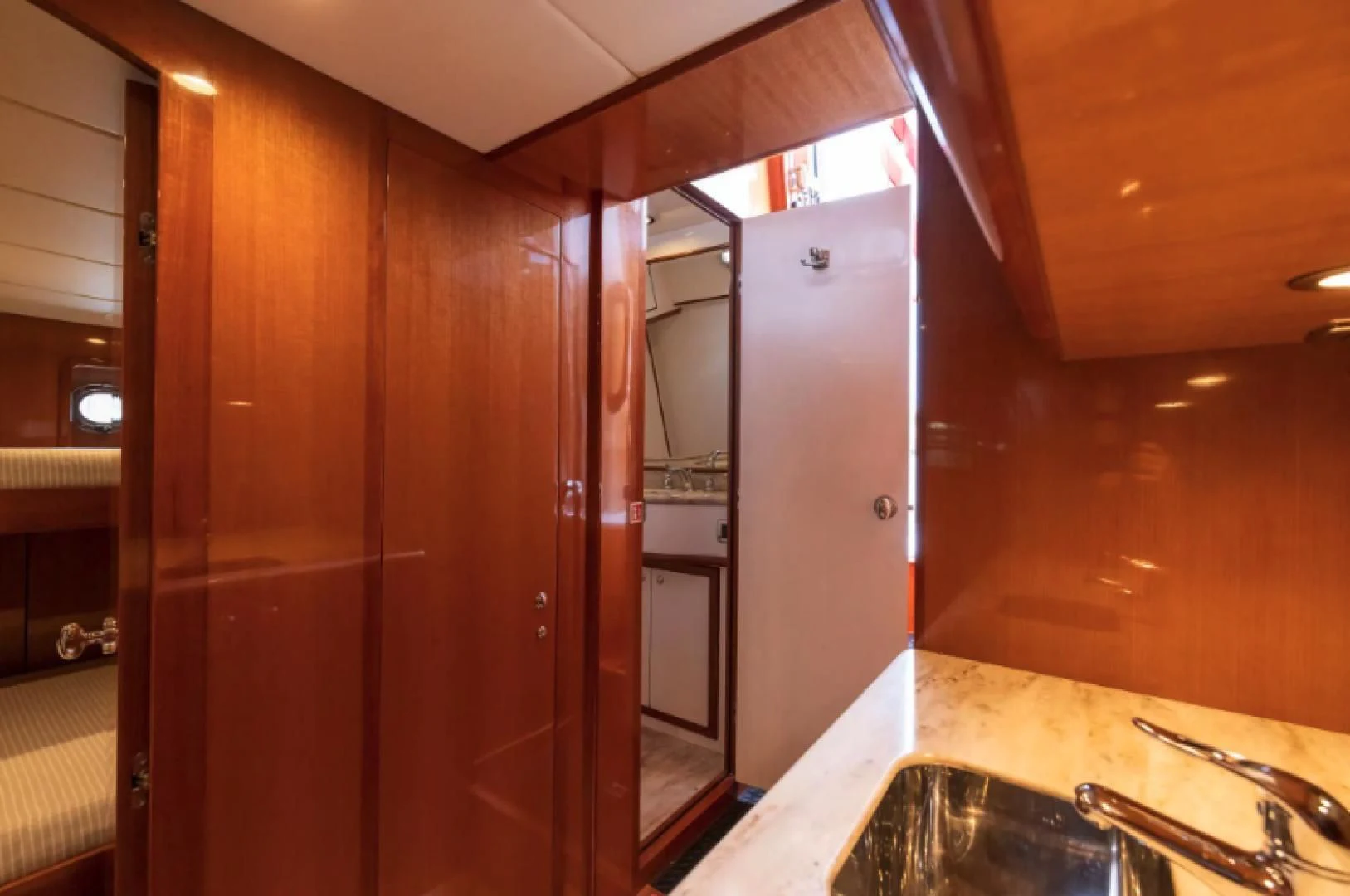 a kitchen with wooden cabinets aboard WRITE SOON Yacht for Sale