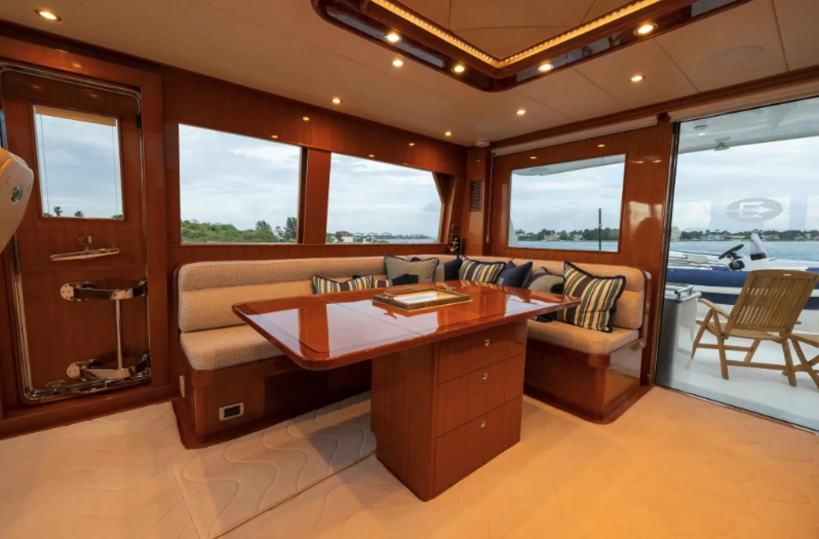a room with a table and chairs aboard WRITE SOON Yacht for Sale
