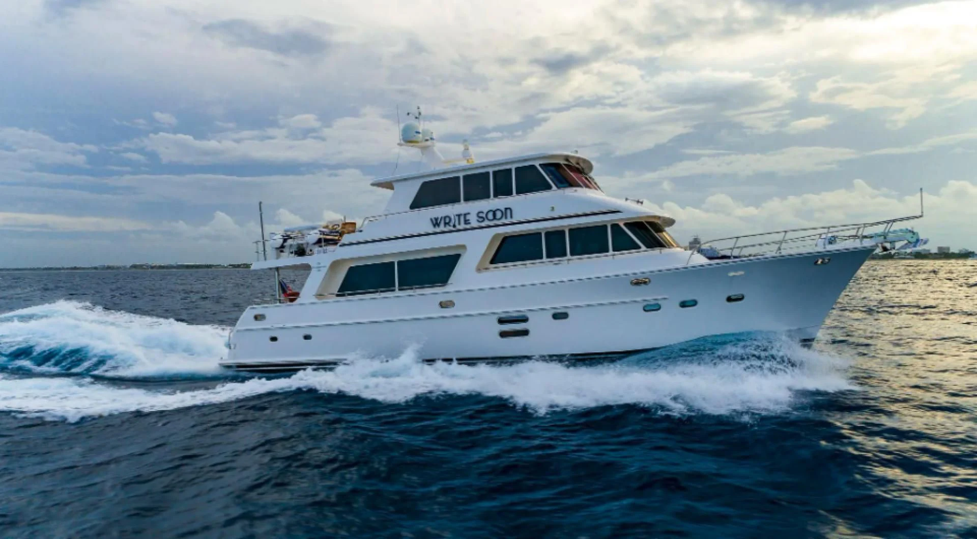 a white boat on the water aboard WRITE SOON Yacht for Sale