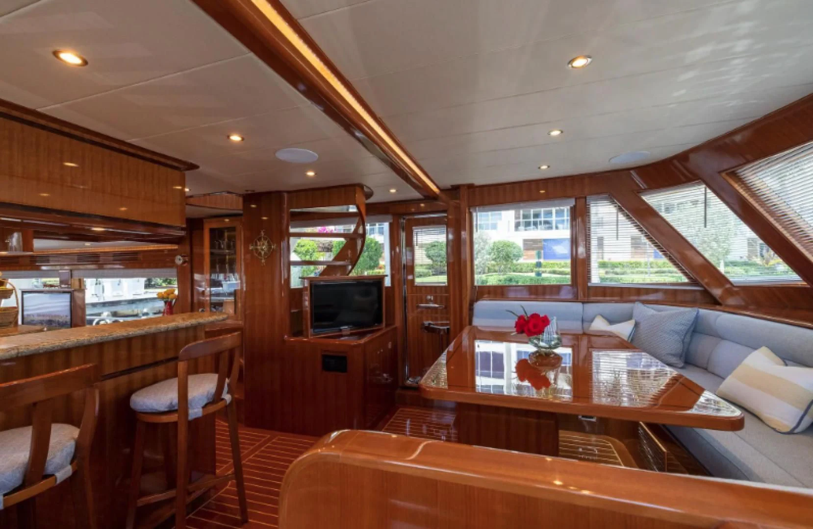 a living room with a kitchen and dining area aboard WRITE SOON Yacht for Sale