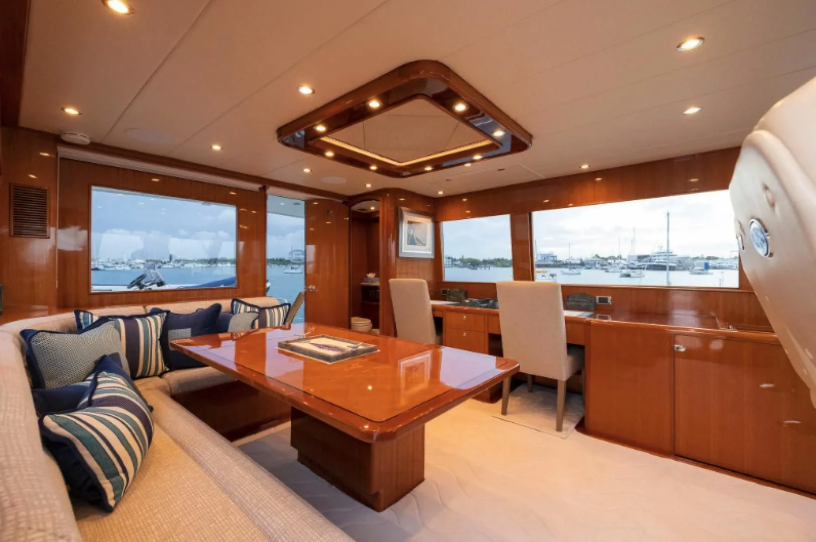 a room with a table and chairs aboard WRITE SOON Yacht for Sale