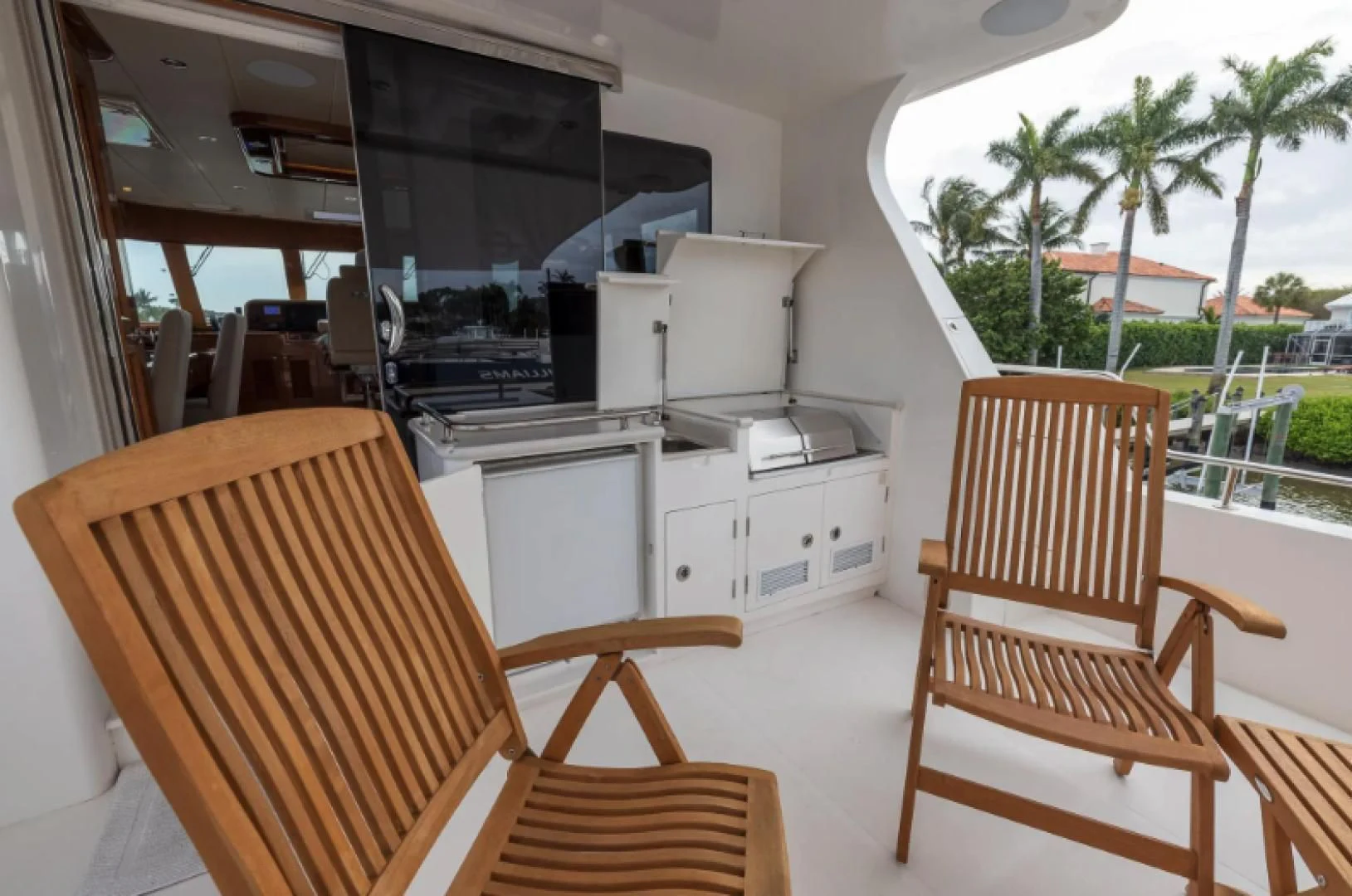 a room with a table chairs and a microwave oven aboard WRITE SOON Yacht for Sale
