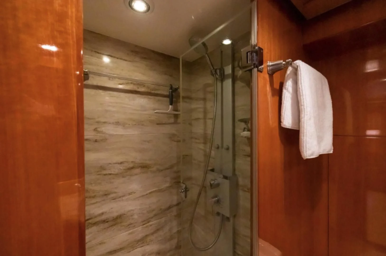a shower unit with a towel on the wall aboard WRITE SOON Yacht for Sale