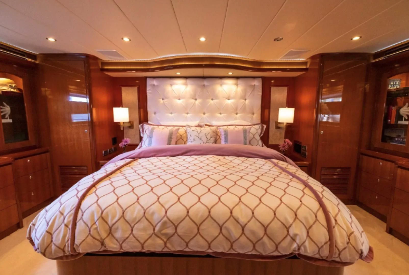a bed with a pink comforter aboard WRITE SOON Yacht for Sale