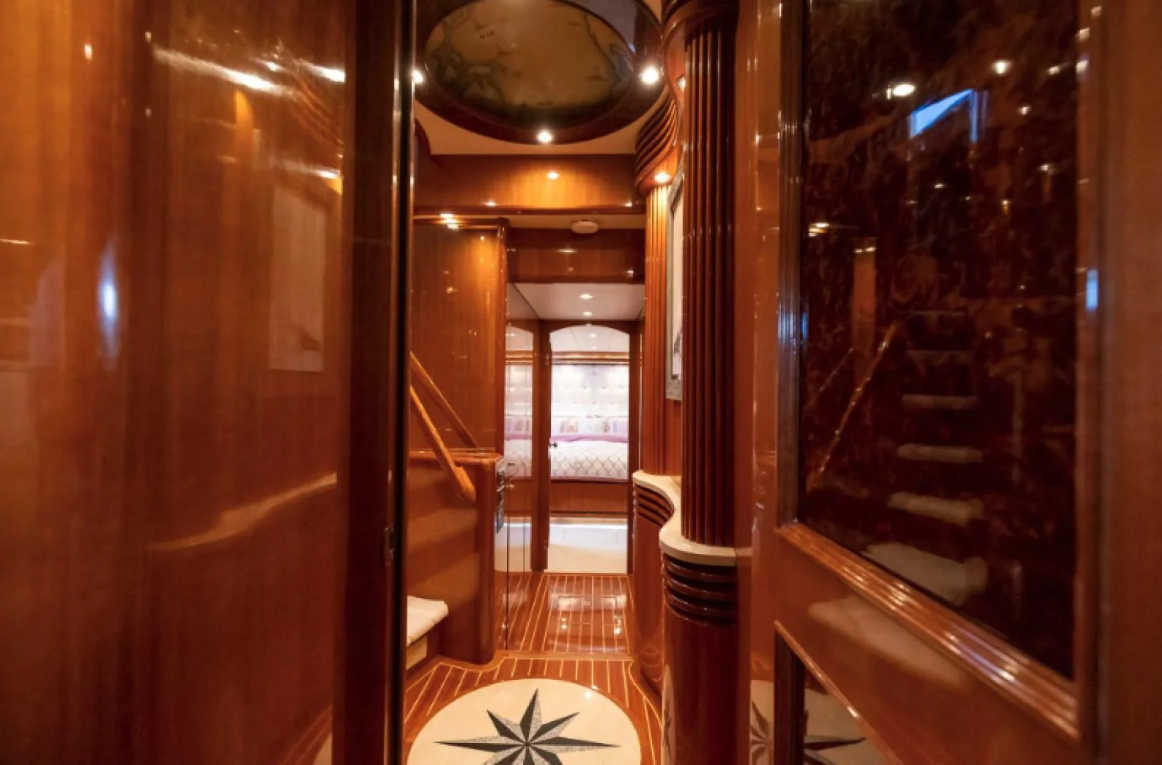 a hallway with a chandelier aboard WRITE SOON Yacht for Sale