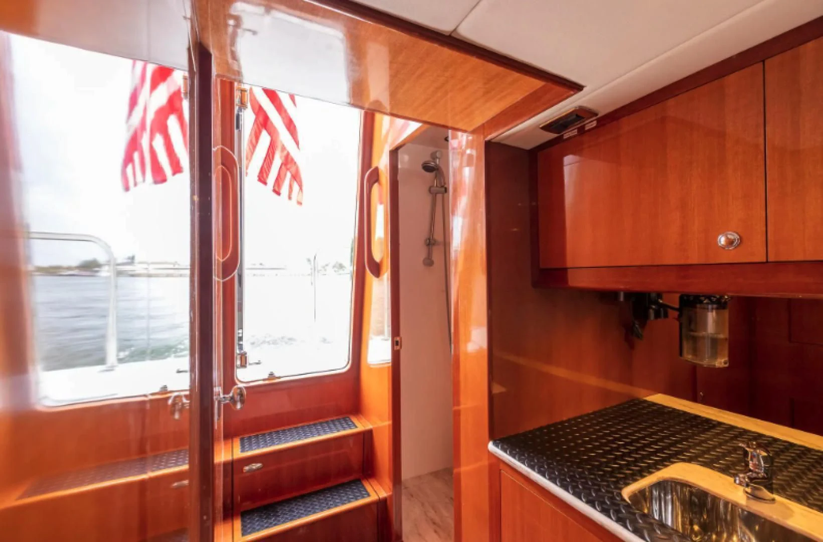 a kitchen with a window aboard WRITE SOON Yacht for Sale