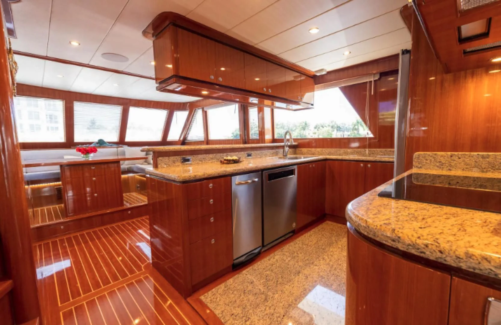 a kitchen with wooden cabinets aboard WRITE SOON Yacht for Sale