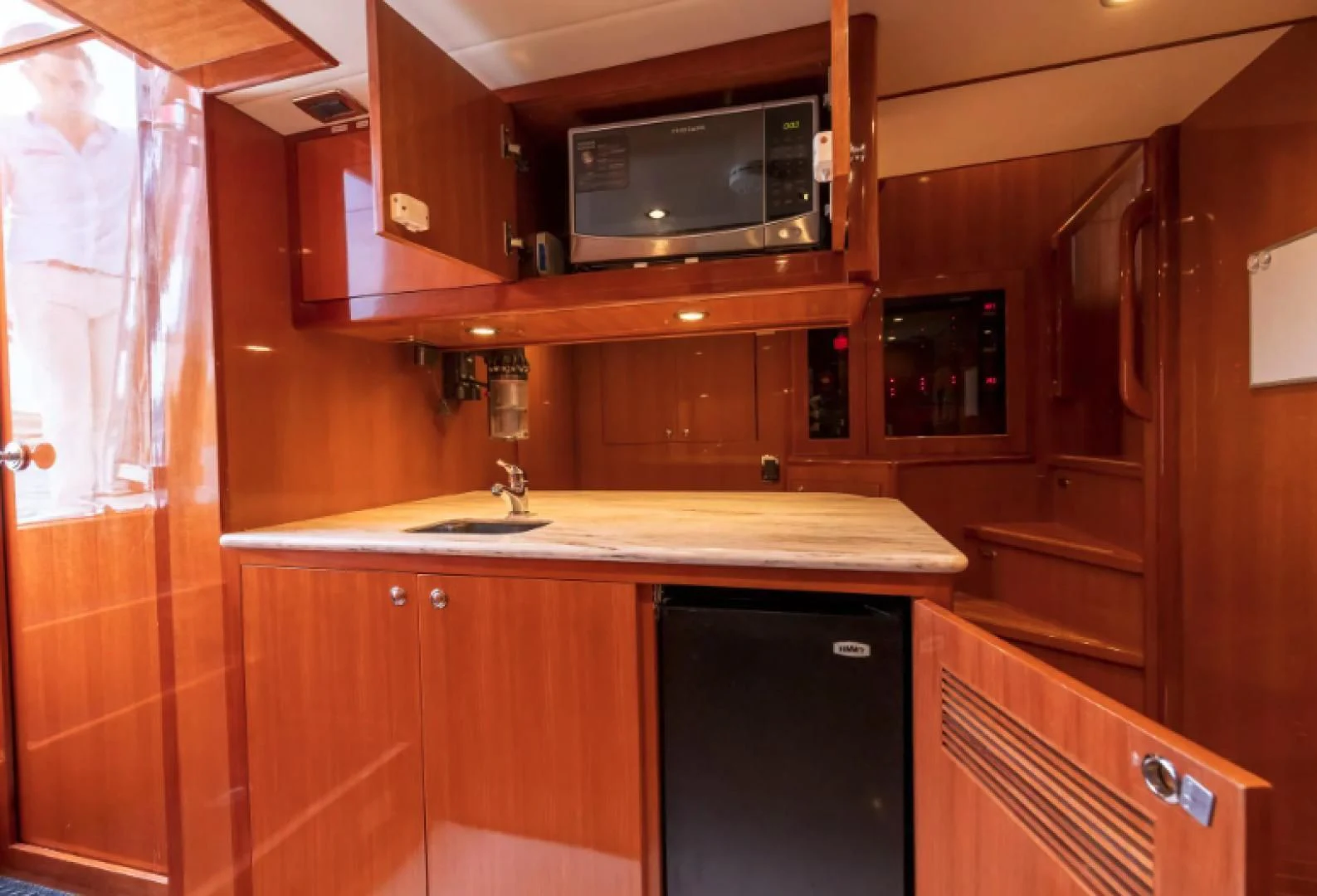 a kitchen with wooden cabinets aboard WRITE SOON Yacht for Sale