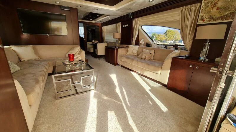 a living room with a large window aboard ABK Yacht for Sale