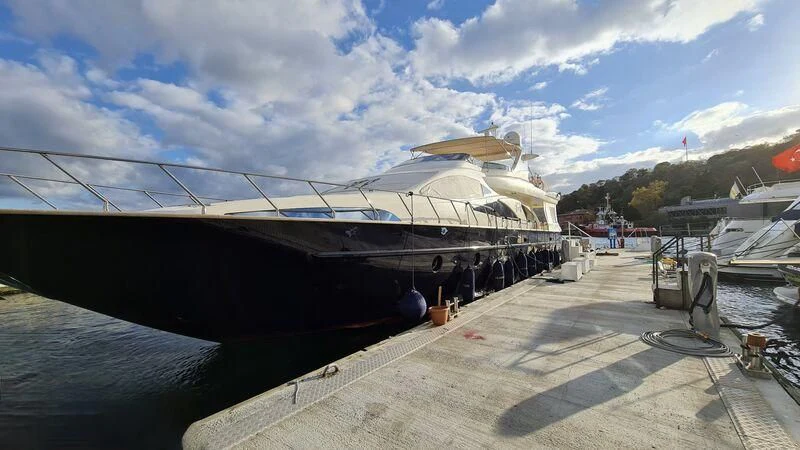 a boat docked at a pier aboard ABK Yacht for Sale