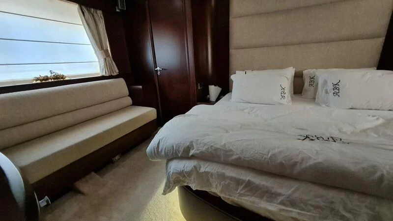 a room with a bed and a window aboard ABK Yacht for Sale