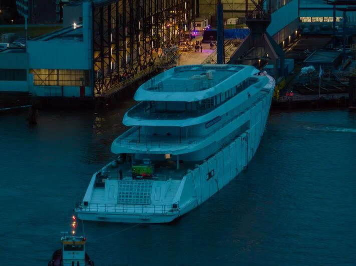 a large ship docked at a port aboard PI Yacht for Sale