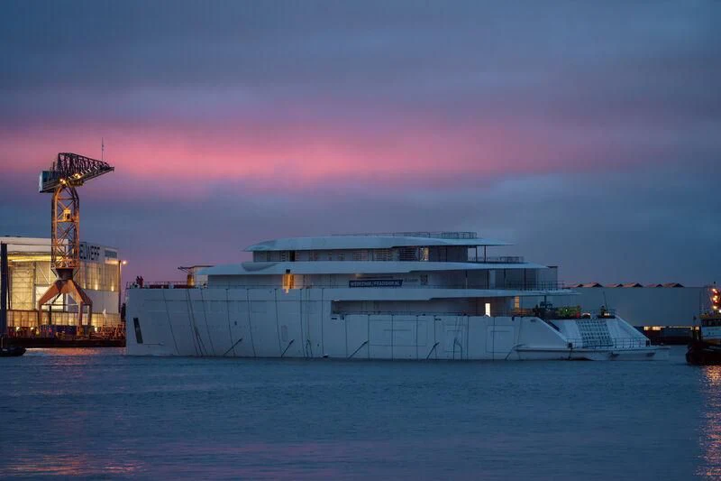 a large white building with a red sky above it aboard PI Yacht for Sale