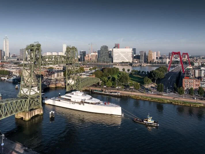 a city with a river and boats aboard PI Yacht for Sale