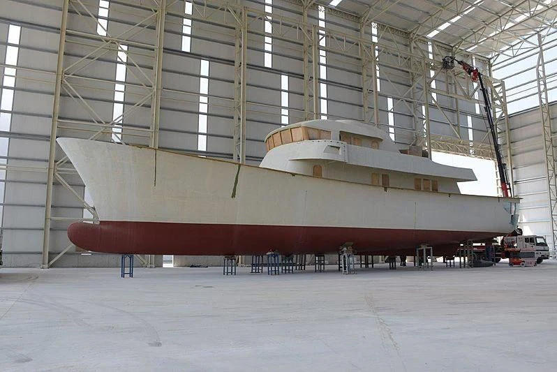 a large red submarine in a warehouse aboard FARMONT/PEER GYNT 38M Yacht for Sale