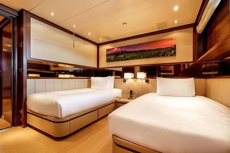 a room with two beds aboard ATLAS Yacht for Sale