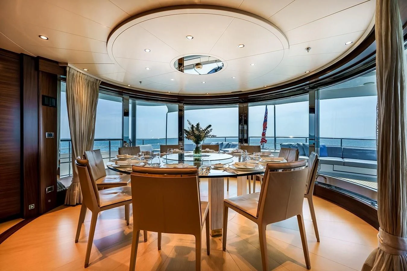 a large dining table in a room aboard ATLAS Yacht for Sale