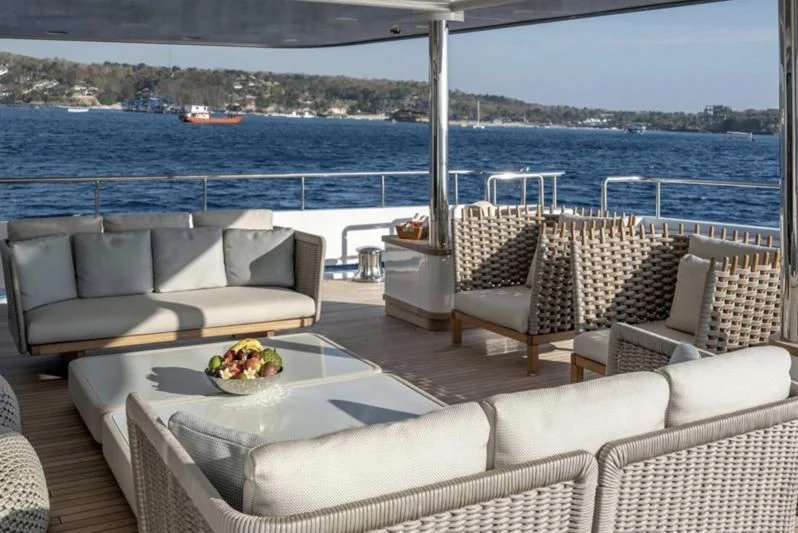 a patio with chairs and a table aboard ATLAS Yacht for Sale