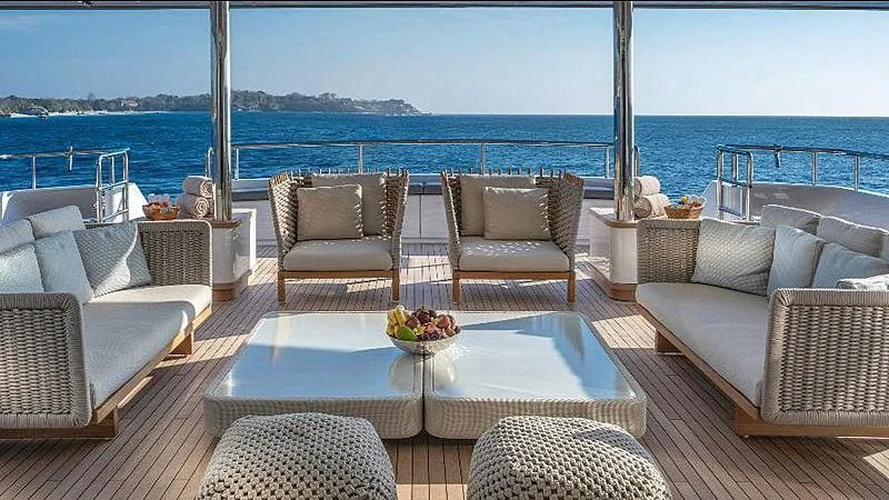 a patio with chairs and a table aboard ATLAS Yacht for Sale