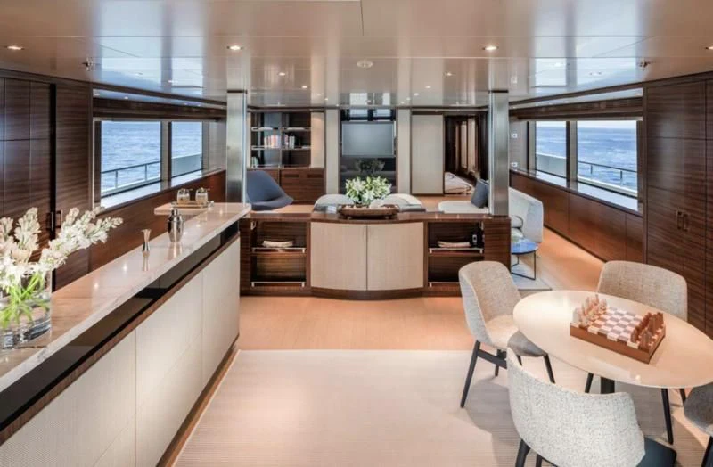 a large open kitchen and dining area aboard ATLAS Yacht for Sale