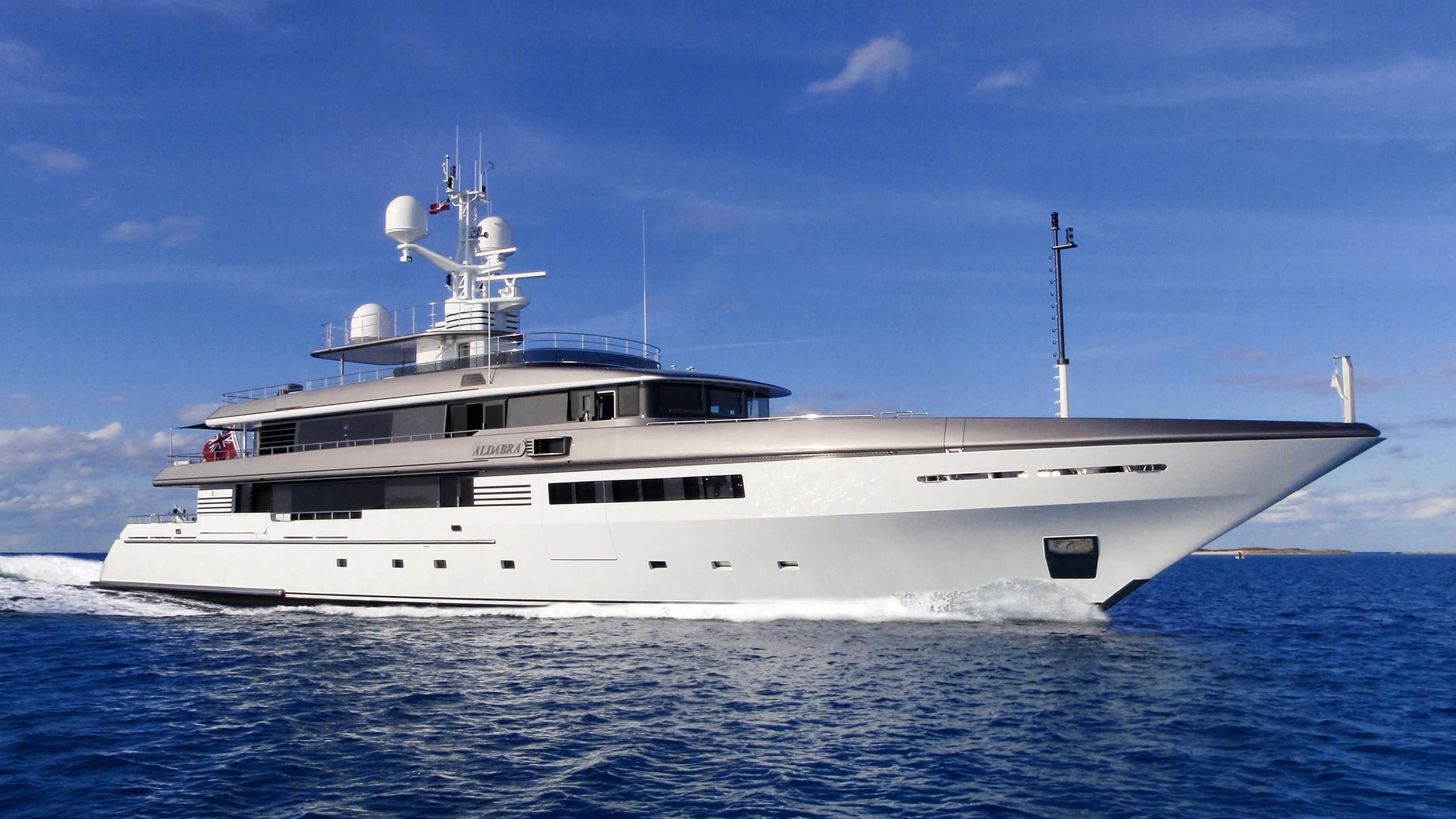 a large white ship in the water aboard ATLAS Yacht for Sale