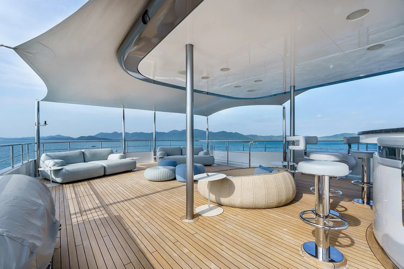 a room with a wood floor and a large window overlooking the ocean aboard ATLAS Yacht for Sale