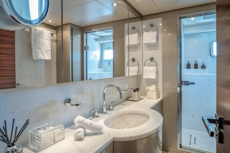 a bathroom with a sink and mirror aboard ATLAS Yacht for Sale