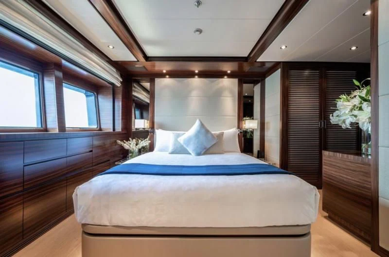 a large bed in a room aboard ATLAS Yacht for Sale