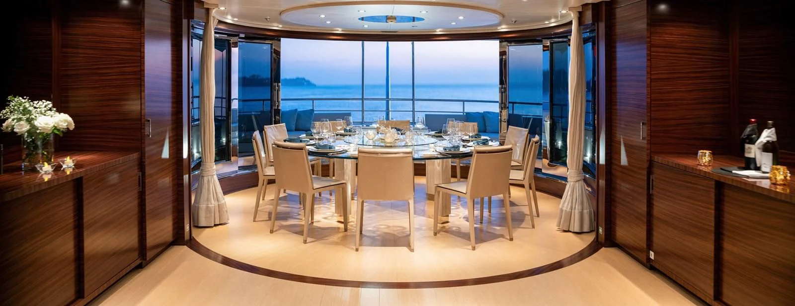 a room with a table and chairs aboard ATLAS Yacht for Sale