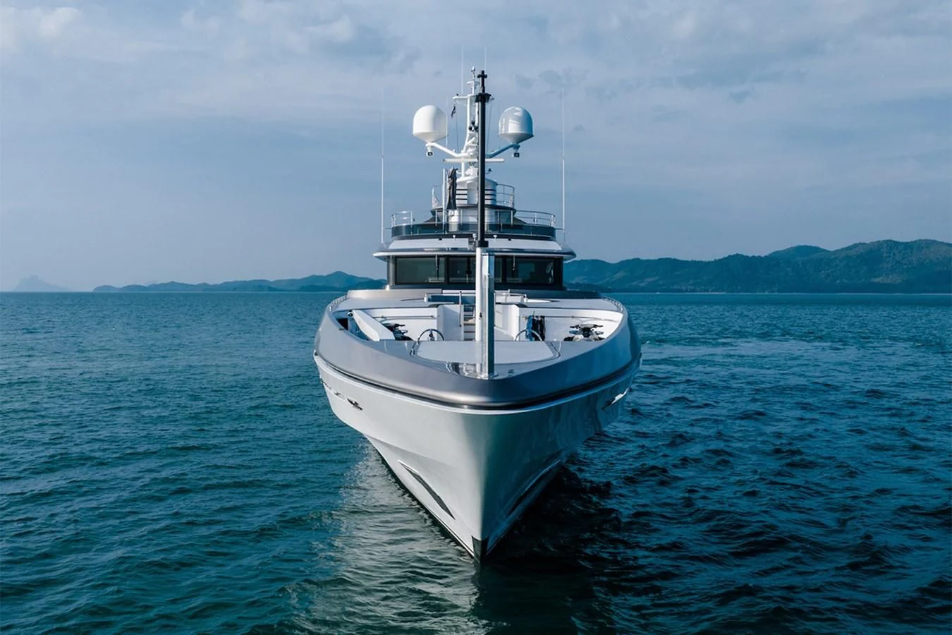 a white boat in the water aboard ATLAS Yacht for Sale