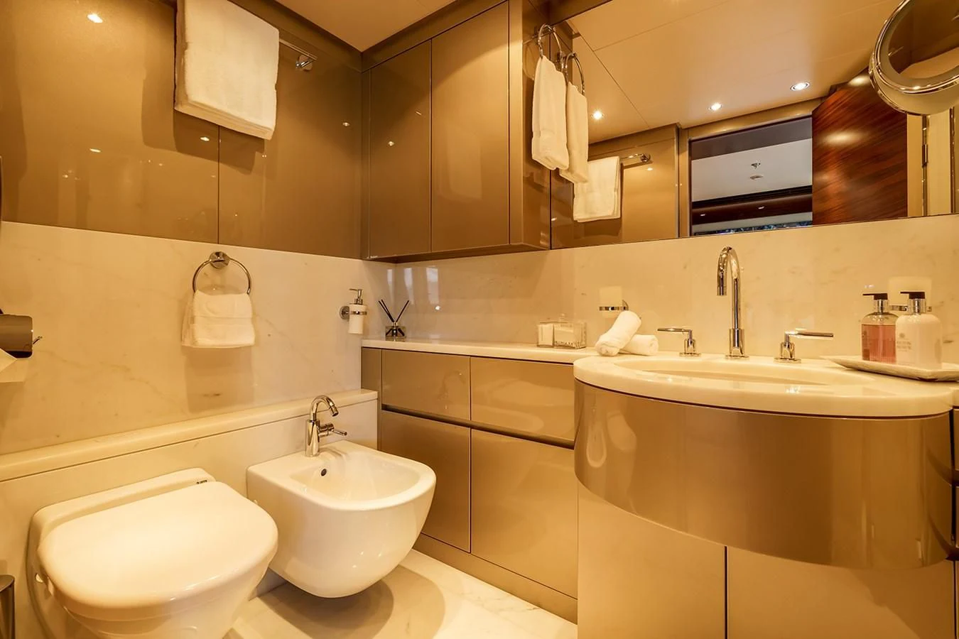 a bathroom with a large mirror aboard ATLAS Yacht for Sale