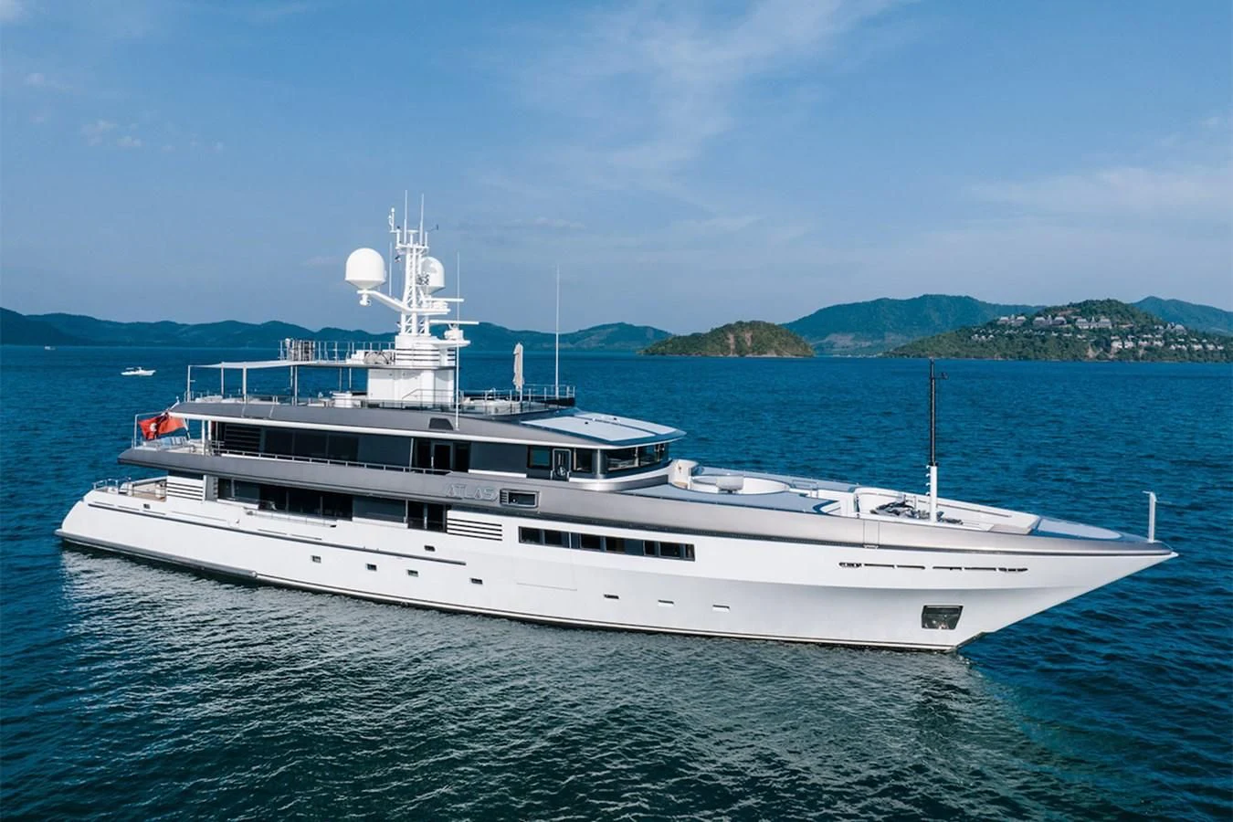 a large white boat in the water aboard ATLAS Yacht for Sale